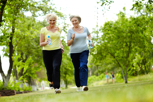 Image of two older women jogging. 