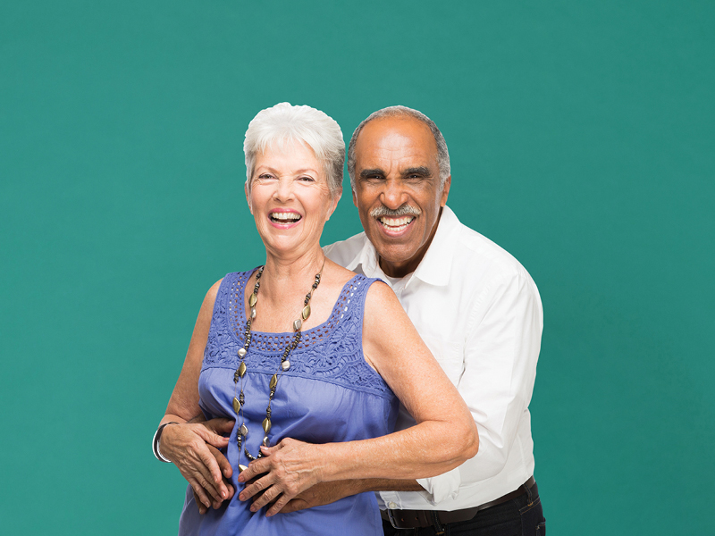 Image of a couple smiling at the camera